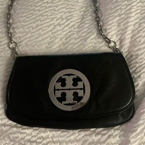 Black with silver chain.  Tory Burch bag.